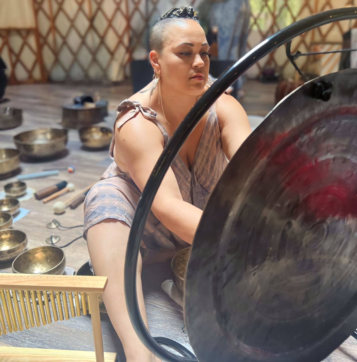 Mama Moon performing a sound bath