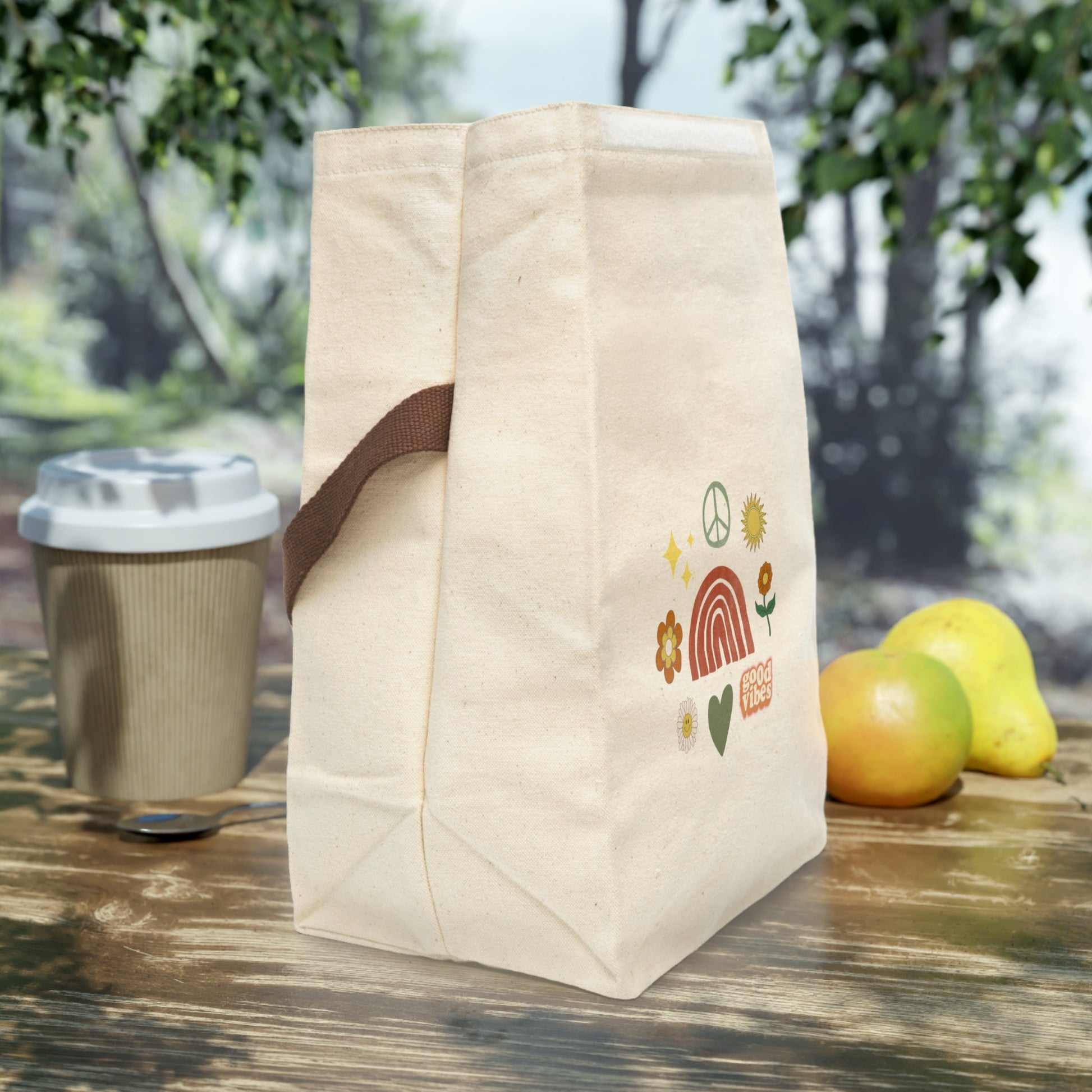 Good Vibes Canvas Lunch Bag With Strap on table